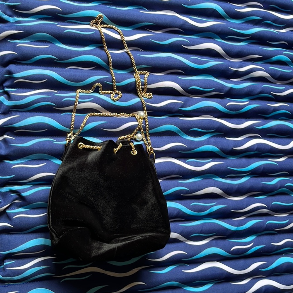 Previously owned, excellent condition black bag with gold chain strap